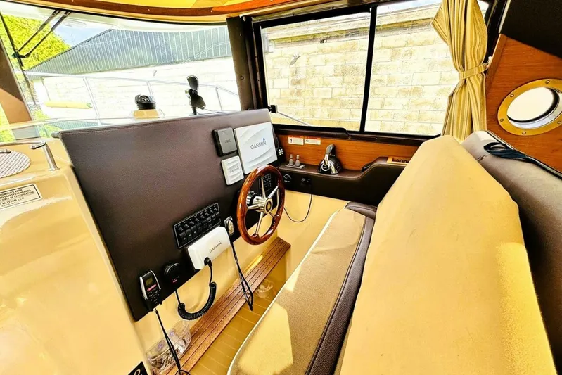  Yacht Photos Pics Interior of 2017 Ranger Tugs R-29S boat with steering wheel and navigation equipment.