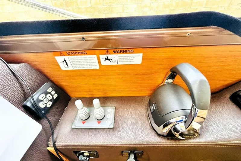  Yacht Photos Pics Control panel of 2017 Ranger Tugs R-29S with warning labels and joystick controls.