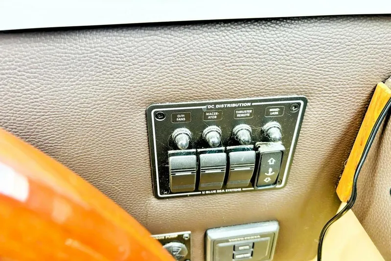  Yacht Photos Pics Control panel of a 2017 Ranger Tugs R-29S boat, featuring DC distribution switches.