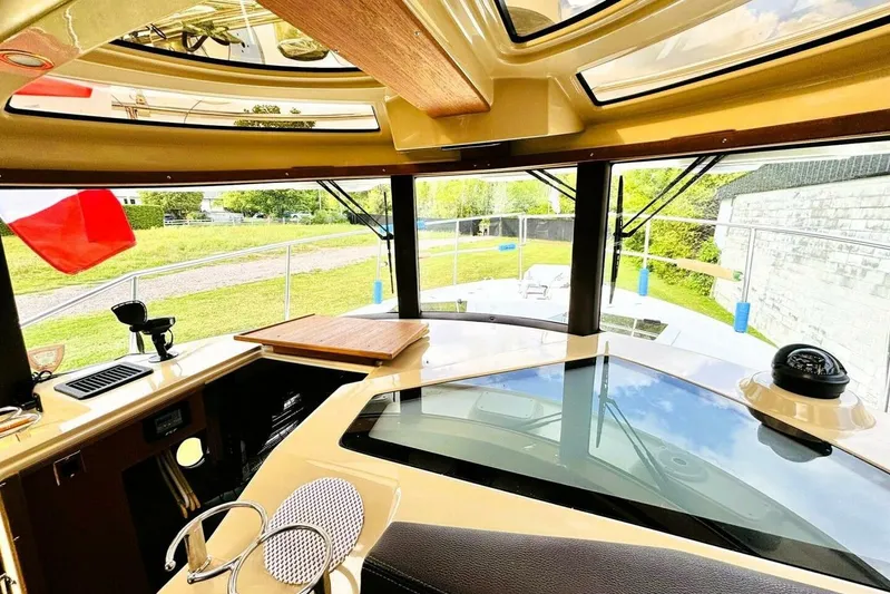  Yacht Photos Pics Interior view of 2017 Ranger Tugs R-29S boat with panoramic windows and modern dashboard.