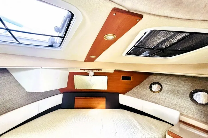  Yacht Photos Pics 2017 Ranger Tugs R-29S cabin interior with skylights and cozy bedding.