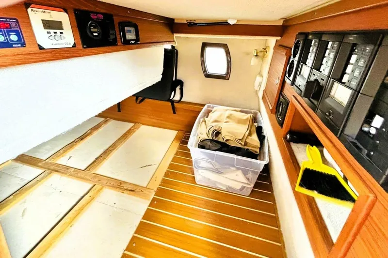  Yacht Photos Pics 2017 Ranger Tugs R-29S interior with control panels and storage area.