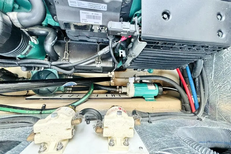  Yacht Photos Pics Engine compartment of a 2017 Ranger Tugs R-29S, showcasing mechanical components and wiring.