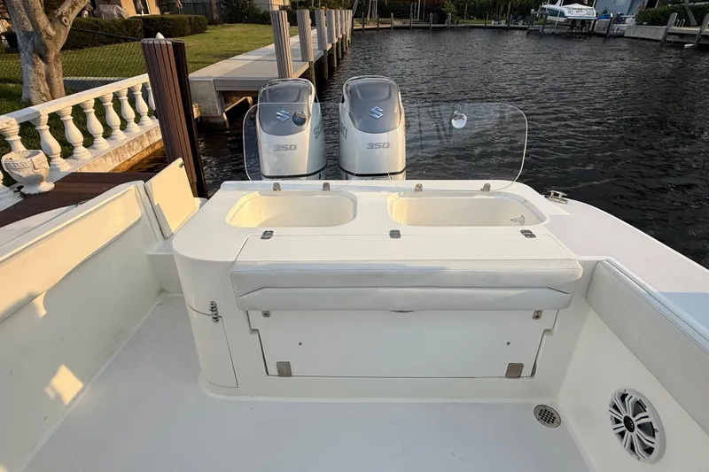  Yacht Photos Pics 2021 Marlin 39 CC boat with dual Suzuki 350 engines docked by the water.