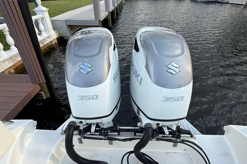  Yacht Photos Pics Twin Suzuki 350 outboard engines on a 2021 Marlin 39 CC boat at a dock.