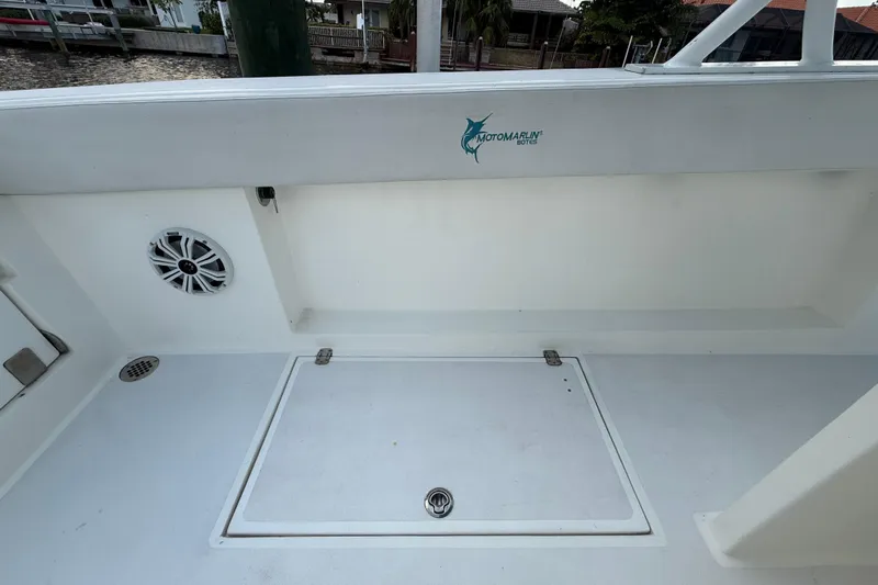  Yacht Photos Pics 2021 Marlin 39 CC boat deck with storage hatch and speaker.