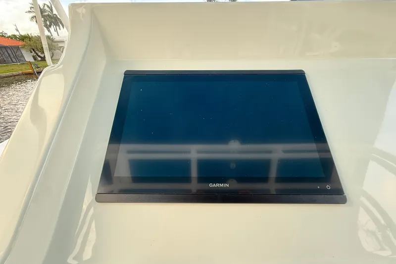  Yacht Photos Pics Garmin display on 2021 Marlin 39 CC boat dashboard, showcasing modern navigation technology.