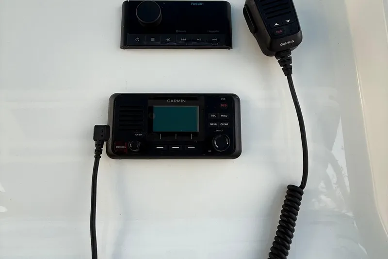  Yacht Photos Pics 2021 Marlin 39 CC boat dashboard with Garmin marine radio and controls.