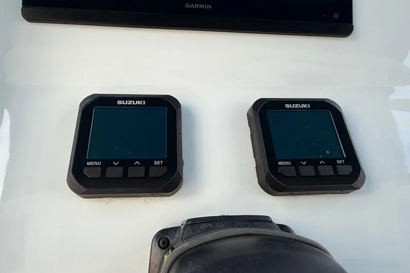  Yacht Photos Pics Suzuki digital displays on 2021 Marlin 39 CC boat dashboard.