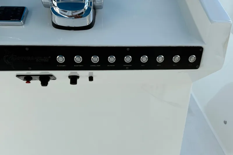  Yacht Photos Pics Control panel of 2021 Marlin 39 CC boat with labeled switches and controls.
