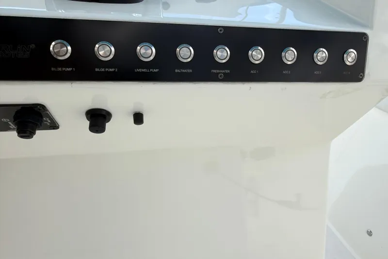  Yacht Photos Pics Control panel of 2021 Marlin 39 CC boat with labeled buttons and switches.