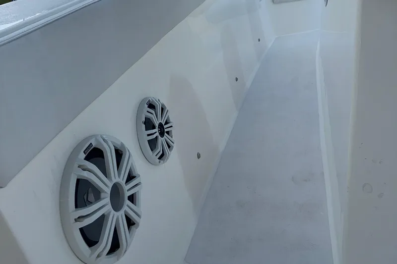  Yacht Photos Pics 2021 Marlin 39 CC boat interior with built-in speakers on white panel.
