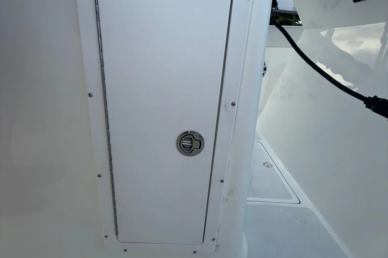  Yacht Photos Pics 2021 Marlin 39 CC boat interior with a closed storage compartment door.