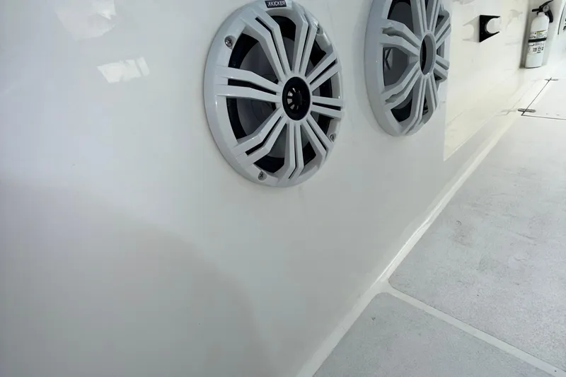  Yacht Photos Pics 2021 Marlin 39 CC boat interior with mounted speakers and fire extinguisher.