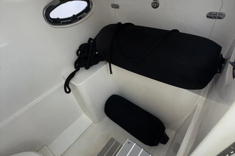  Yacht Photos Pics 2021 Marlin 39 CC boat interior with black fenders and ropes.