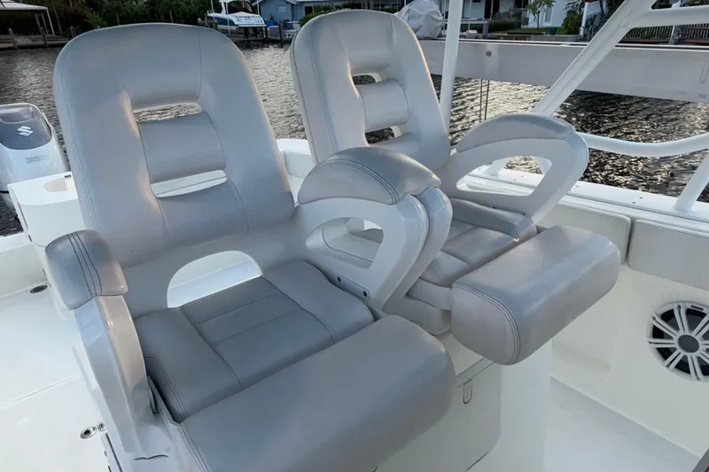  Yacht Photos Pics 2021 Marlin 39 CC boat with luxurious gray seating and armrests.