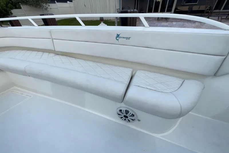  Yacht Photos Pics 2021 Marlin 39 CC boat with white cushioned seating and speaker.