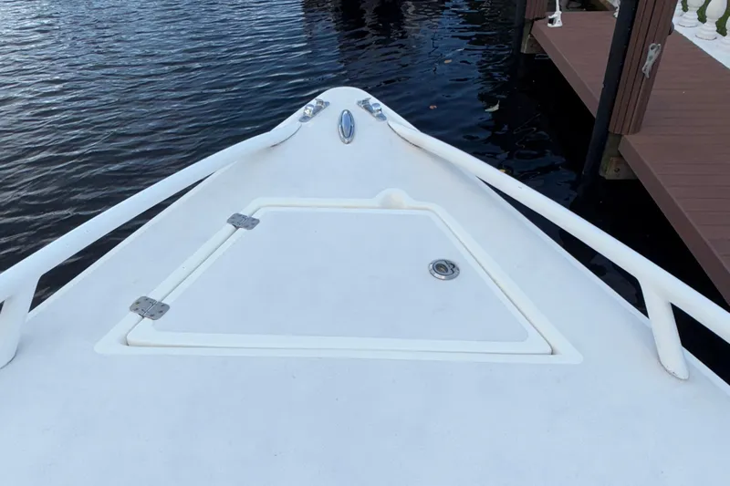  Yacht Photos Pics Bow of 2021 Marlin 39 CC boat docked by the water.