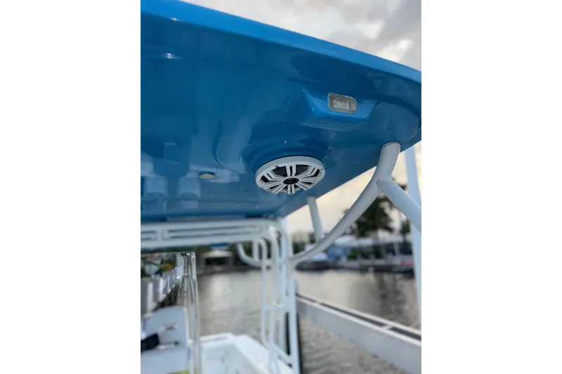  Yacht Photos Pics 2021 Marlin 39 CC boat with blue canopy and speaker system.