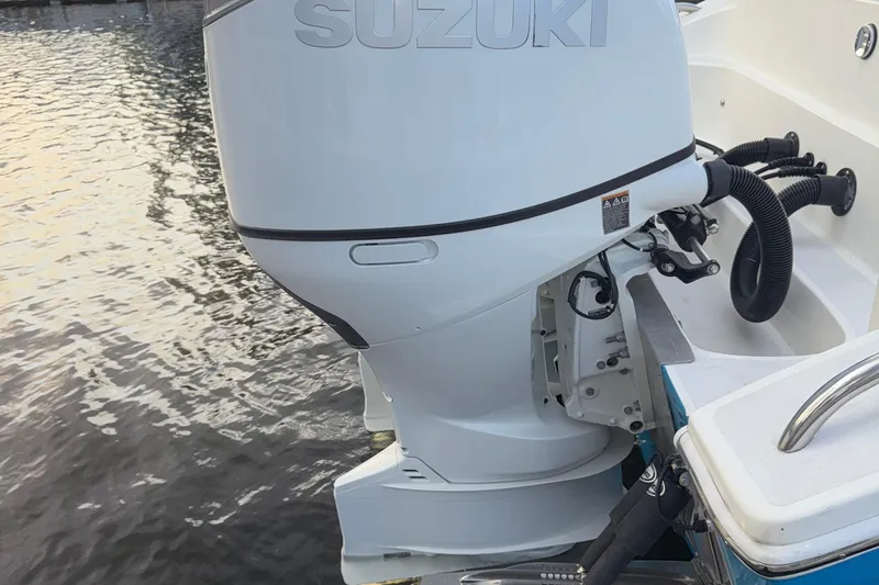  Yacht Photos Pics 2021 Marlin 39 CC boat with Suzuki outboard motor on water.