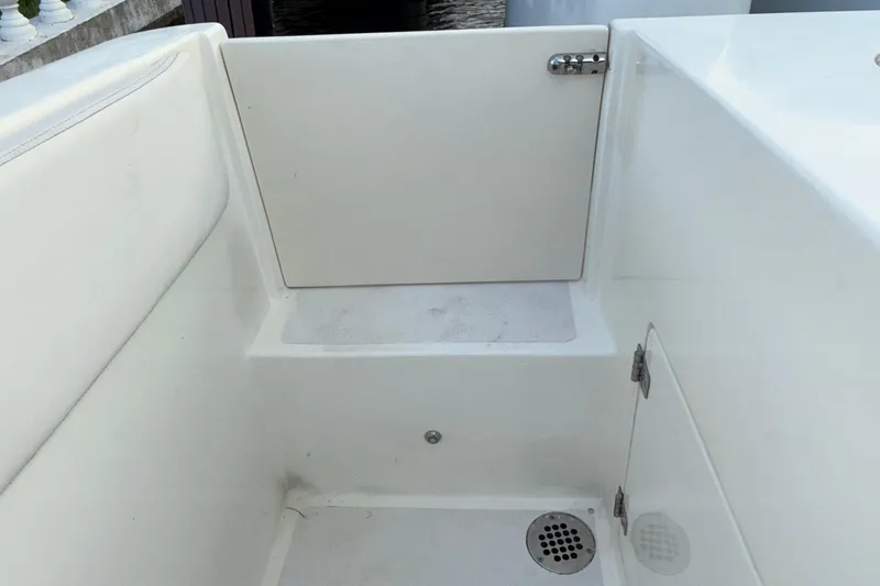  Yacht Photos Pics 2021 Marlin 39 CC boat interior with white seating and drainage area.