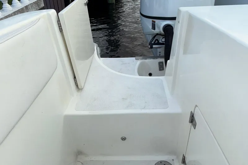  Yacht Photos Pics 2021 Marlin 39 CC boat deck with open hatch and visible engine.