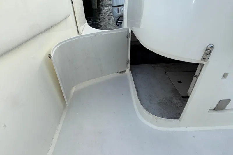  Yacht Photos Pics 2021 Marlin 39 CC boat with open storage compartment, white interior.