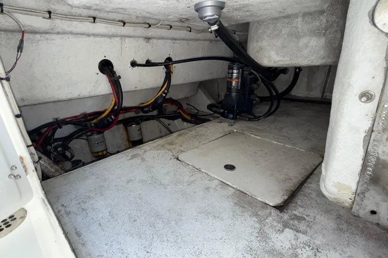  Yacht Photos Pics Engine compartment of 2021 Marlin 39 CC boat, showing wiring and mechanical components.