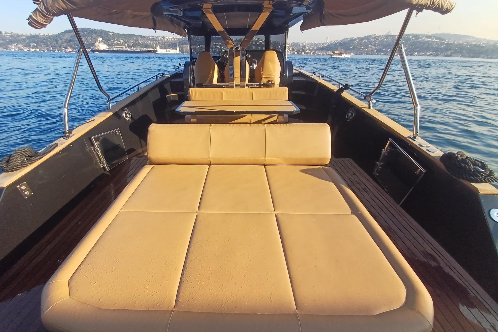 Luxurious 2024 Focus Forza 37 yacht with spacious deck and comfortable seating on the water.