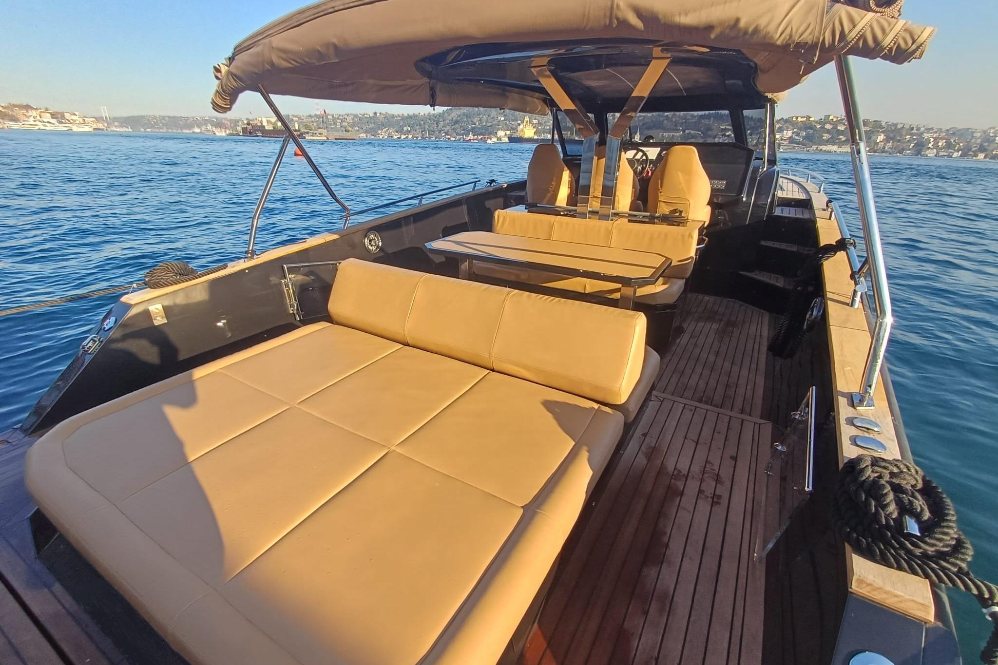 Luxurious 2024 Focus Forza 37 yacht with spacious seating on a sunny day at sea.