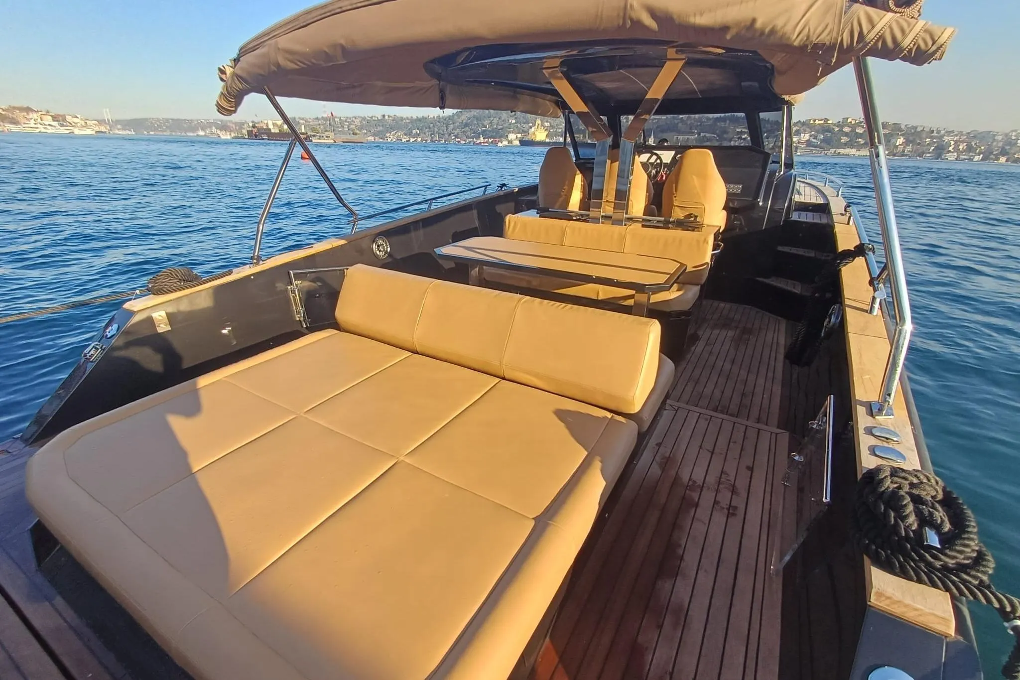 Luxurious 2024 Focus Forza 37 yacht with spacious seating on a sunny day at sea.