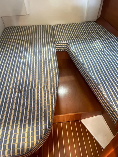 Jethro Yacht Photos Pics Interior cabin of 2003 Jeanneau Sun Odyssey 54 DS with striped cushions.