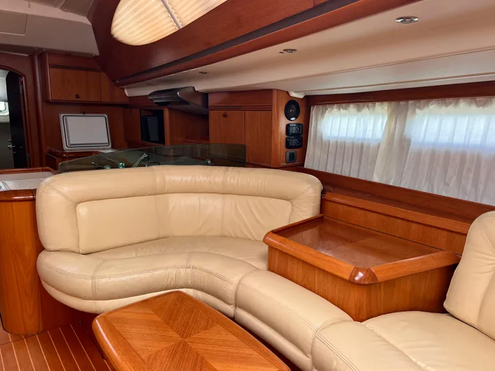 Jethro Yacht Photos Pics Luxurious interior of 2003 Jeanneau Sun Odyssey 54 DS yacht with leather seating.