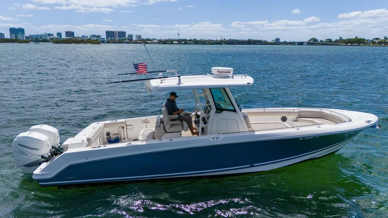 Rocco Yacht Photos Pics 2020 Boston Whaler 330 Outrage boat cruising on a sunny day.