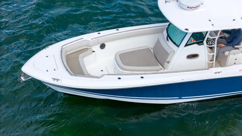 Rocco Yacht Photos Pics 2020 Boston Whaler 330 Outrage boat on water, top view.