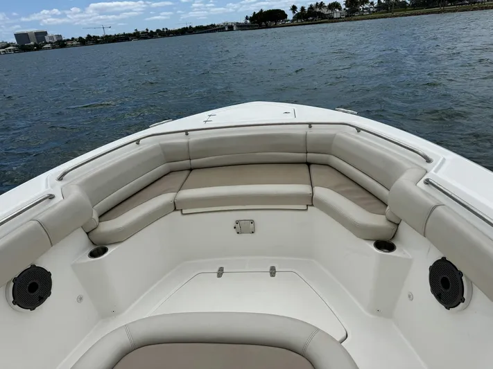 Rocco Yacht Photos Pics 2020 Boston Whaler 330 Outrage boat with cushioned seating on the water.