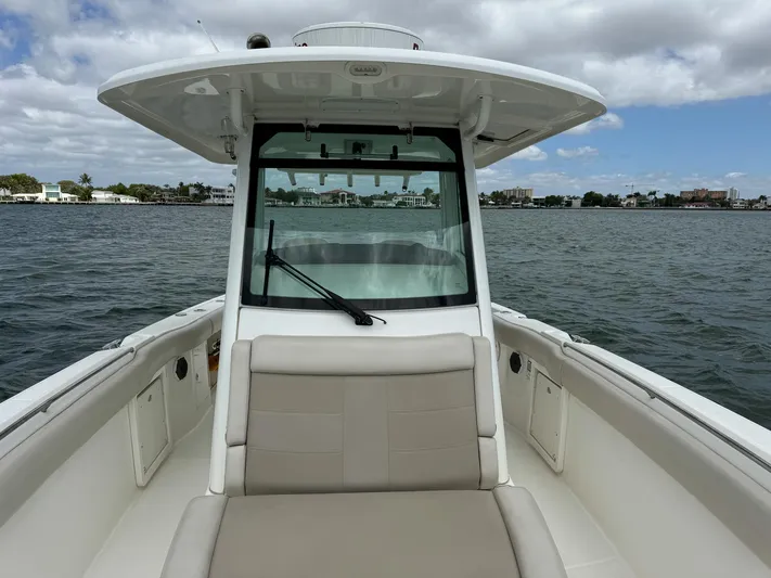 Rocco Yacht Photos Pics 2020 Boston Whaler 330 Outrage boat on calm water with clear skies.