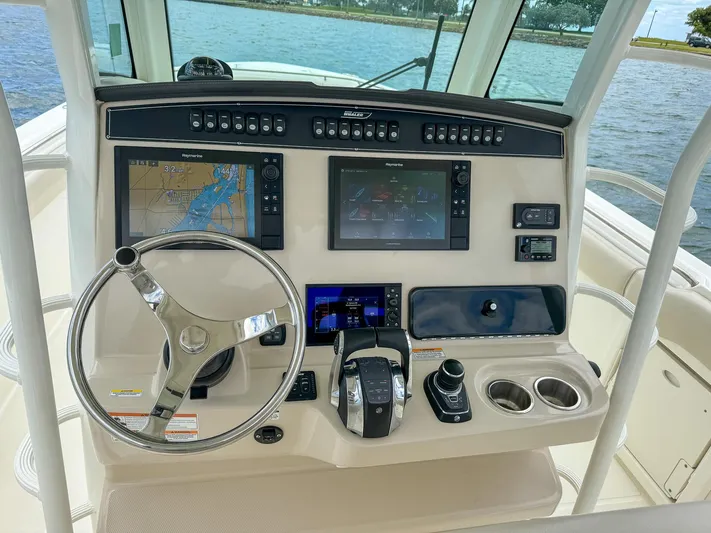 Rocco Yacht Photos Pics 2020 Boston Whaler 330 Outrage helm with advanced navigation and control systems.