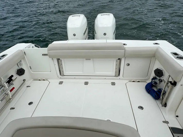 Rocco Yacht Photos Pics Boston Whaler 330 Outrage 2020 boat deck with twin outboard engines.