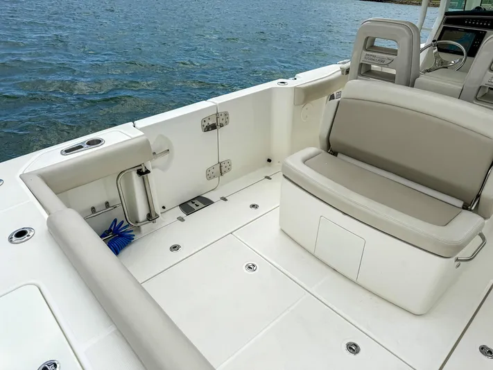 Rocco Yacht Photos Pics 2020 Boston Whaler 330 Outrage boat interior with seating and ocean view.