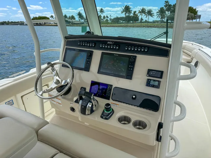 Rocco Yacht Photos Pics 2020 Boston Whaler 330 Outrage helm with advanced navigation systems.