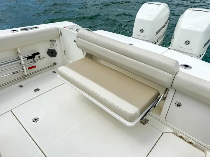 Rocco Yacht Photos Pics Boston Whaler 330 Outrage 2020 model with foldable rear bench seat and twin outboard engines.