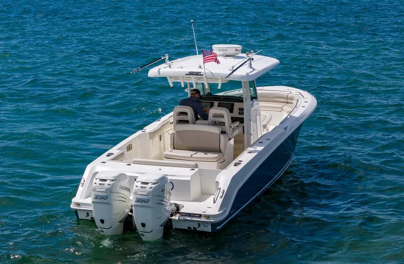 Rocco Yacht Photos Pics 2020 Boston Whaler 330 Outrage boat cruising on open water.