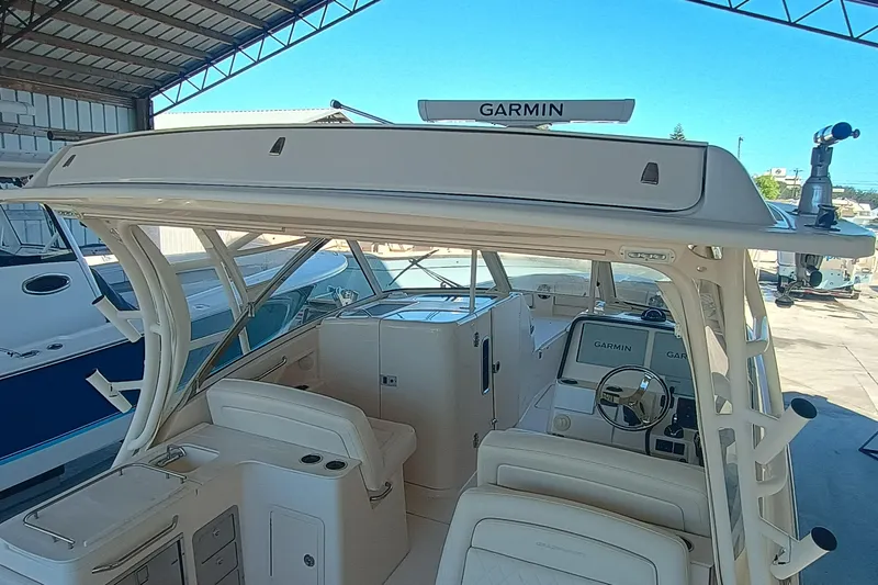 325-708 Brokerage Josh Yacht Photos Pics 2021 Grady-White Freedom 325 boat interior with Garmin navigation system.
