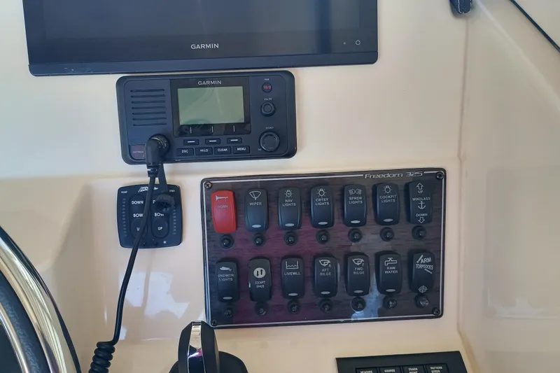 325-708 Brokerage Josh Yacht Photos Pics Control panel of 2021 Grady-White Freedom 325 boat with Garmin electronics and switches.