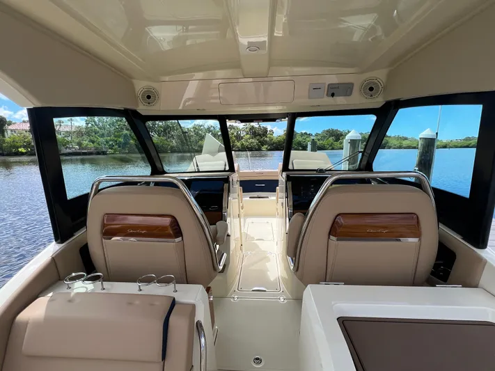  Yacht Photos Pics 2024 Chris-Craft Calypso 32 interior with luxurious seating and panoramic windows.