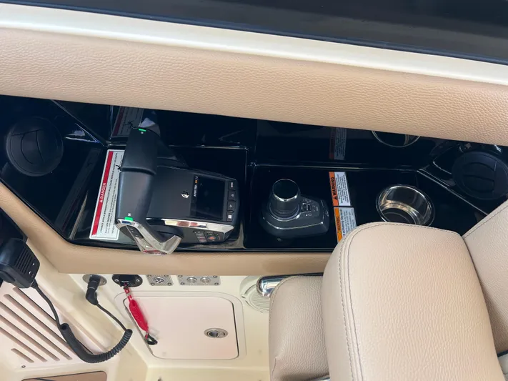  Yacht Photos Pics 2024 Chris-Craft Calypso 32 boat interior with control panel and cup holders.