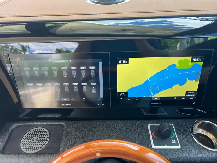  Yacht Photos Pics 2024 Chris-Craft Calypso 32 dashboard with Garmin navigation displays.