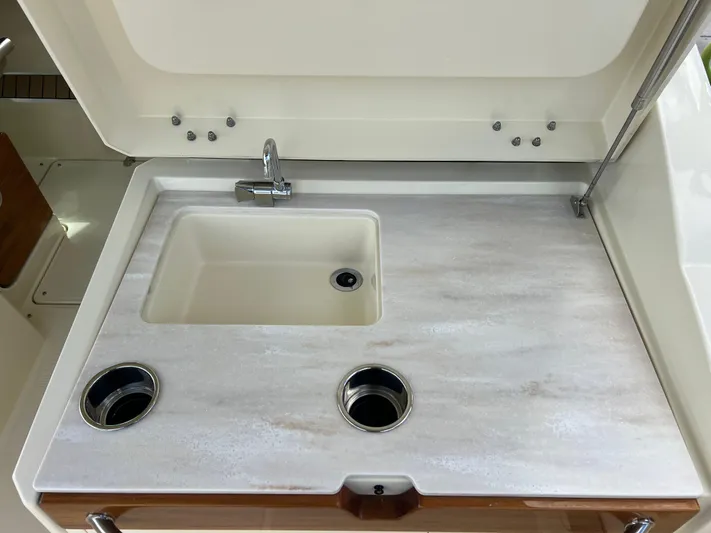  Yacht Photos Pics 2024 Chris-Craft Calypso 32 boat sink with countertop and faucet.
