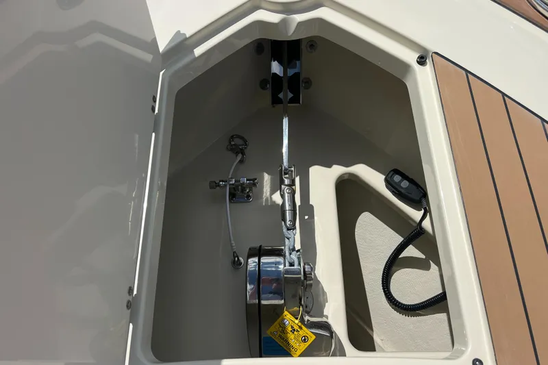  Yacht Photos Pics 2024 Chris-Craft Calypso 32 anchor compartment with winch and controls.